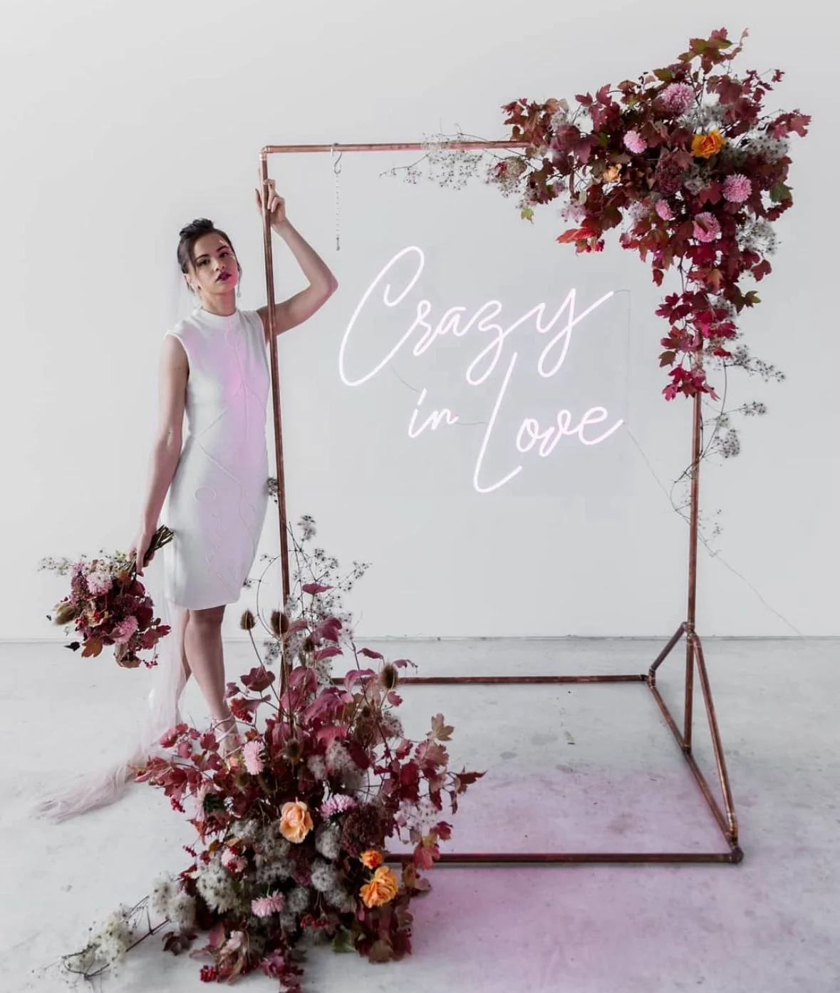 Large copper frame standing 1.8m tall and 1m wide. Used to hang neon signs from or branding, decorated with real flowers, great for weddings, corporate events, parties, celebrations, event decoration
