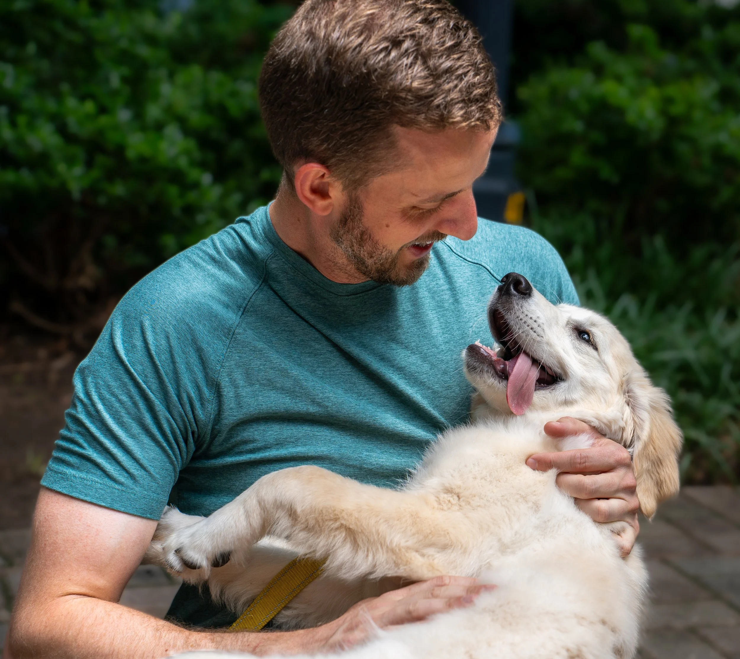 Atlanta dog owner photographed with a cute puppy.
