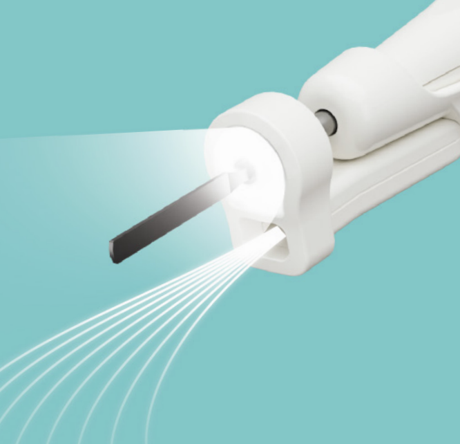 A close-up of a white handheld device emitting light and multiple lines, possibly a sterilization or UV light device on a teal background.