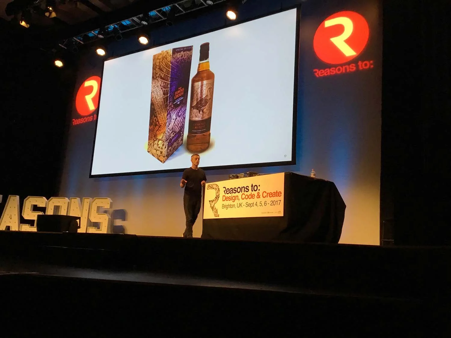 Vic Lee presenting a talk about overcoming self-doubt and creative confidence
