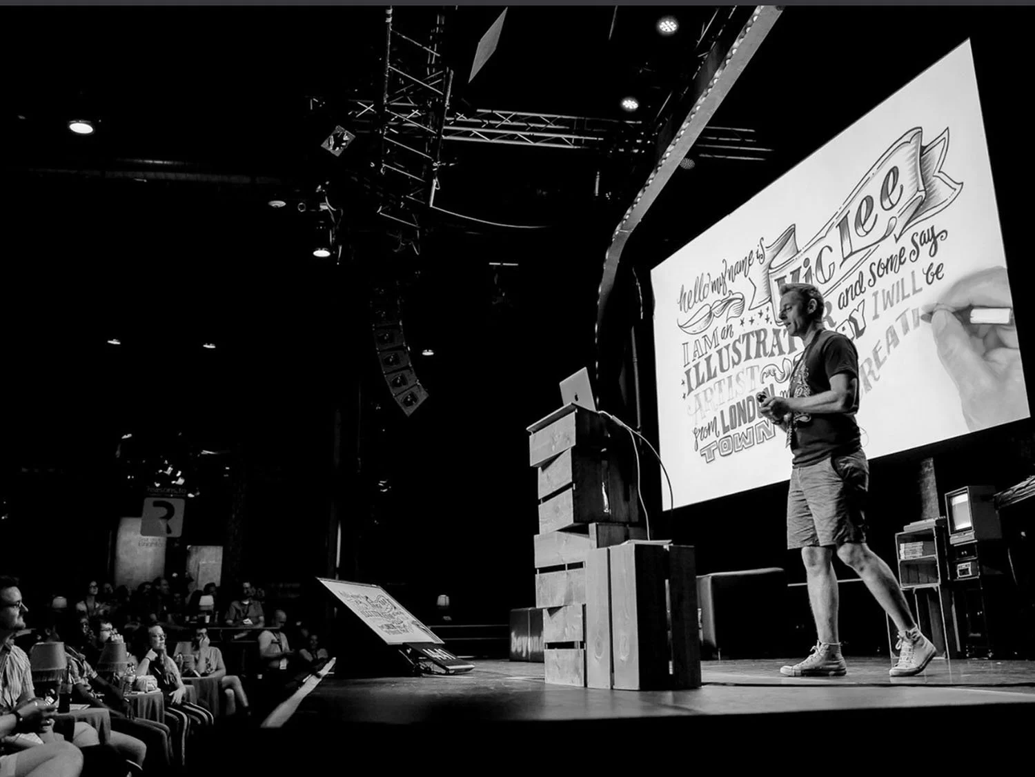 Vic Lee speaking at a creative conference about storytelling and creativity