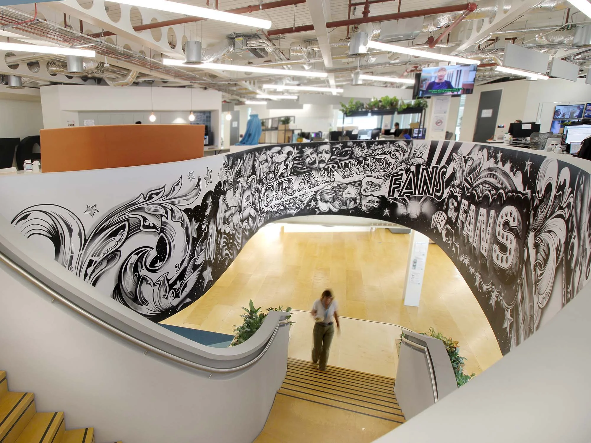 Large-scale storytelling mural by Vic Lee at UKTV and BBC Studios London