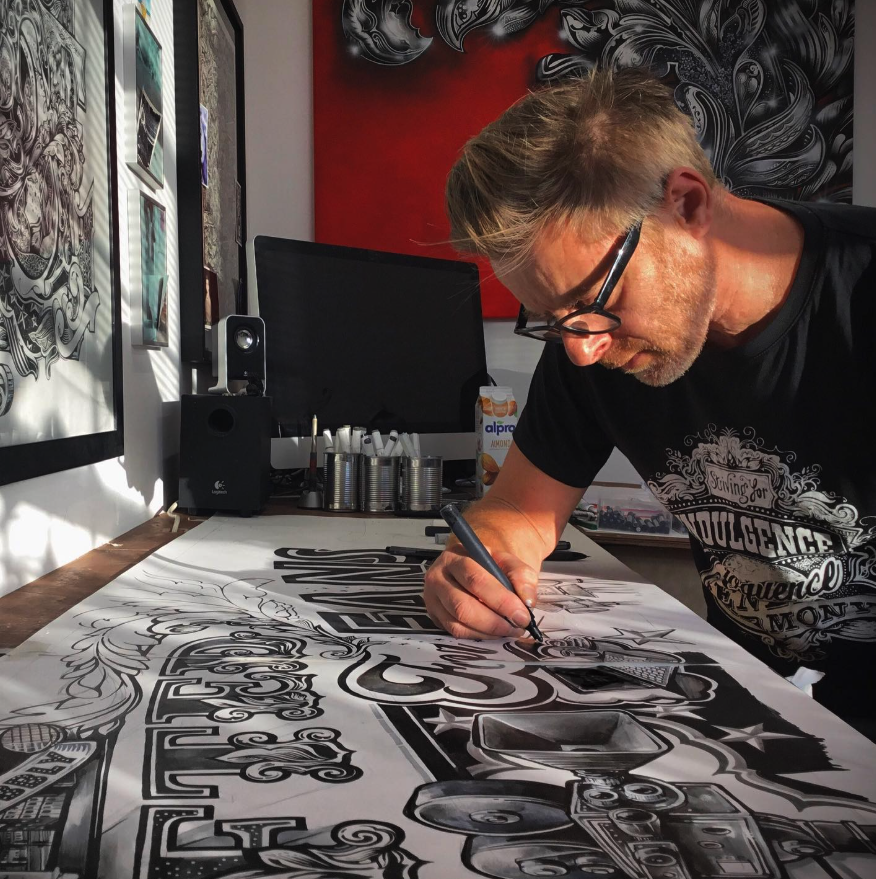 Artist Vic Lee drawing intricate typography and illustration by hand