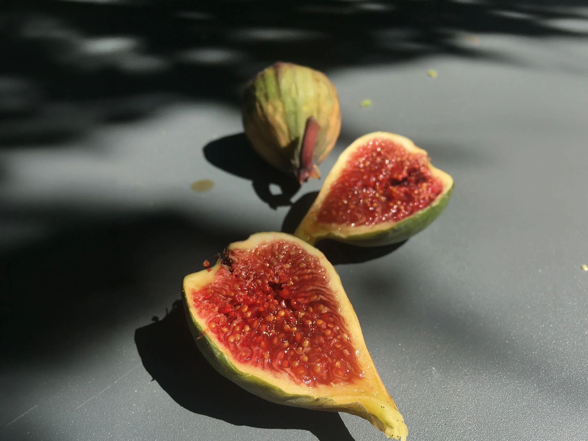 Fresh figs photographed in sunlight during Vic Lee's summer travels in the South of France.