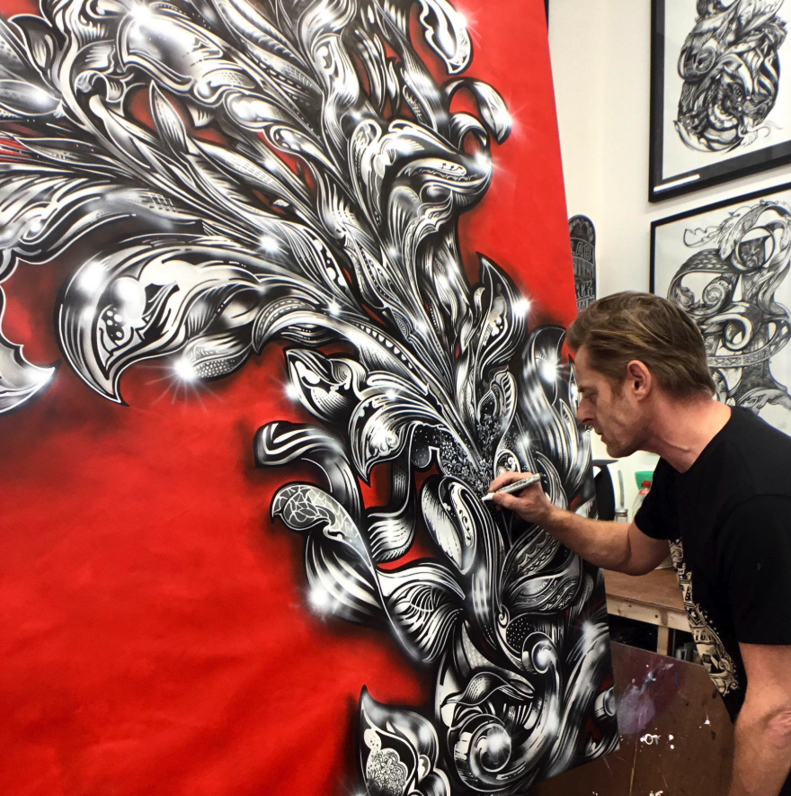 Vic Lee creating an original hand-drawn artwork in his Peckham studio