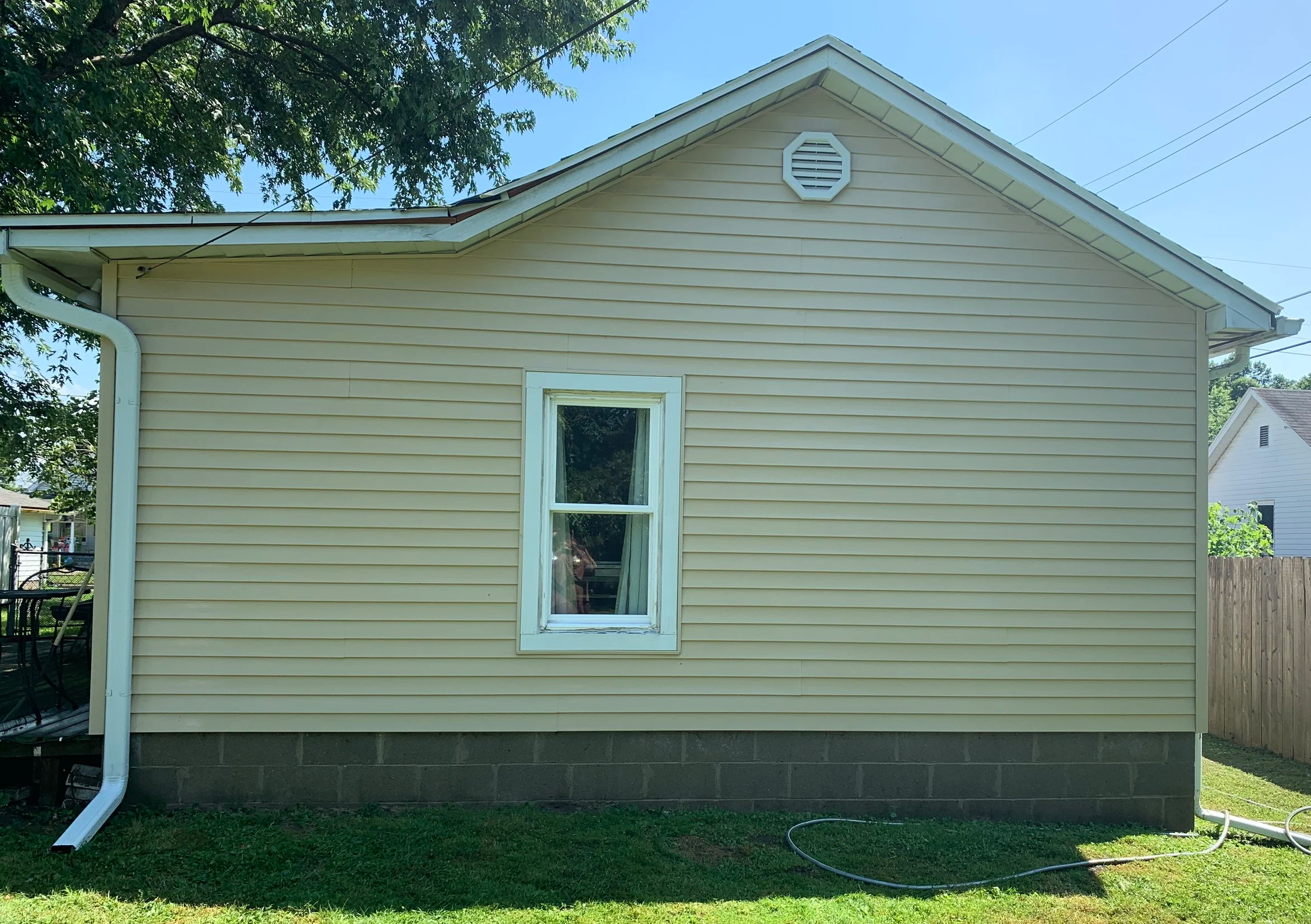 After: Our softwash exterior cleaning removed stains, algae, and grime from the vinyl siding, revealing a brighter, cleaner finish. This Bloomington, Indiana home now looks refreshed and well-maintained without the risk of pressure damage.