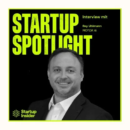 Cover of Startup Spotlight magazine featuring an interview with Roy Uhlmann of MOTOR Ai, with a black and green color scheme and a black and white photo of Roy Uhlmann wearing a suit.