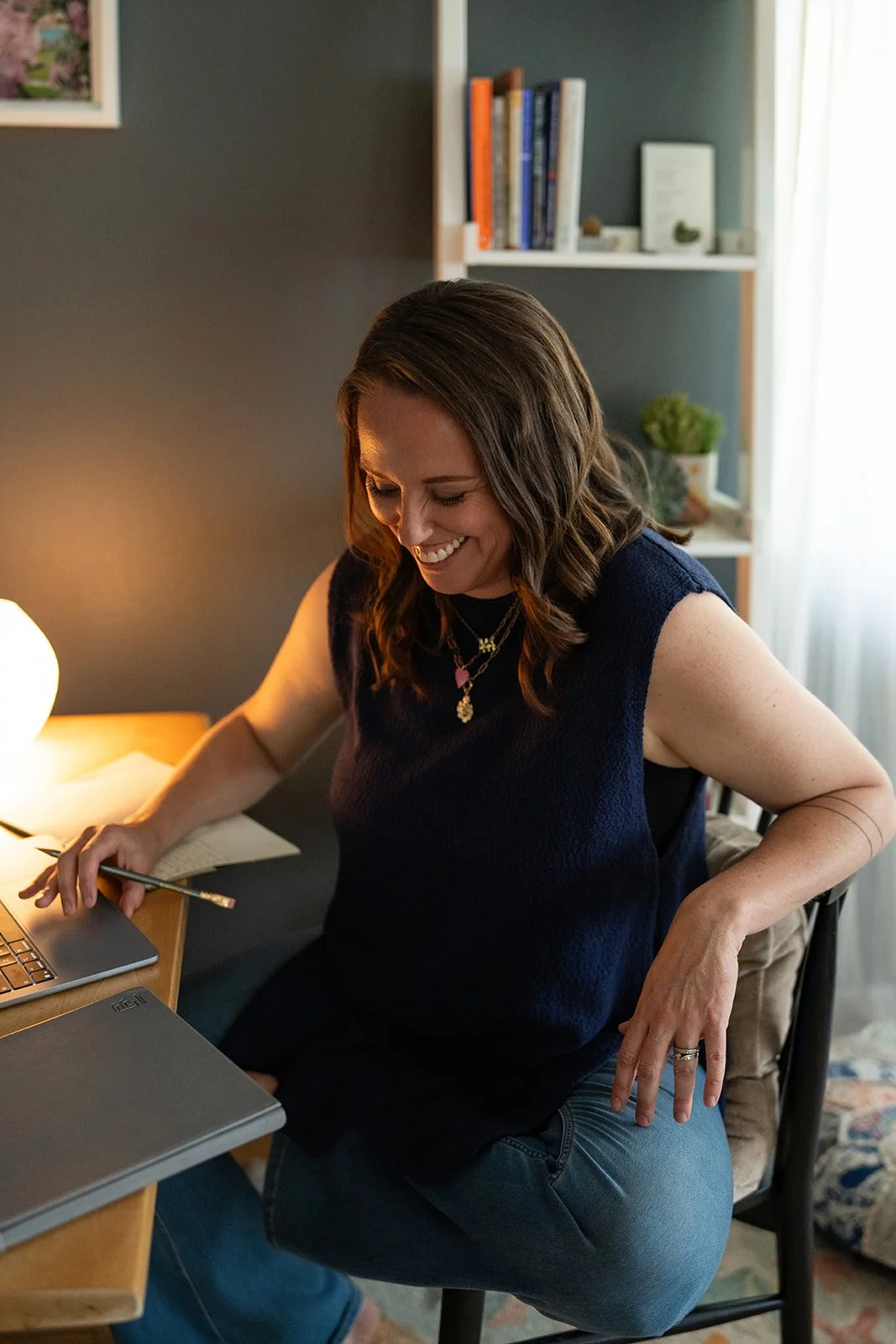 Beth Wienert smiling in her Denver therapy office