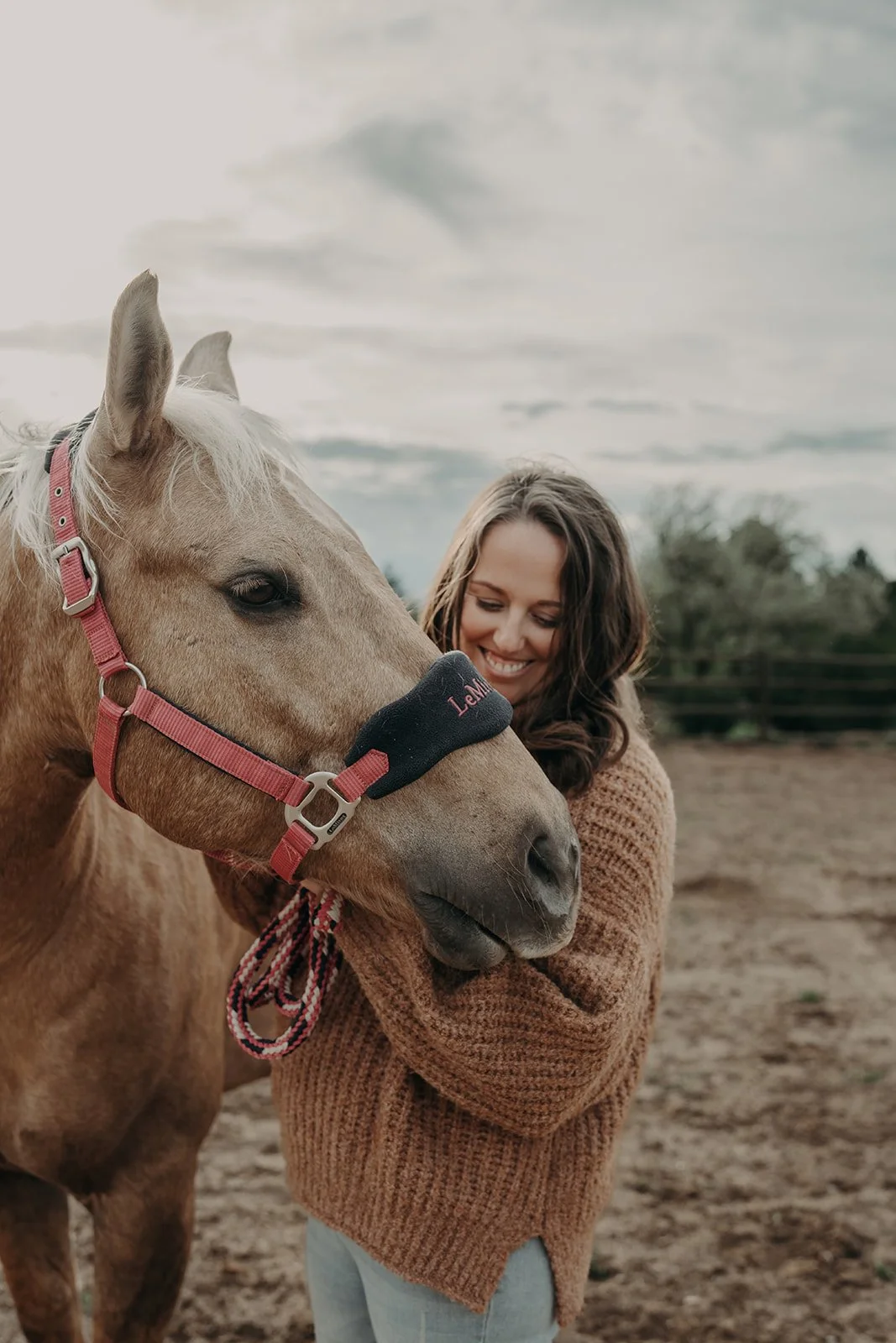 Beth Wienert with her horse on her Colorado property
