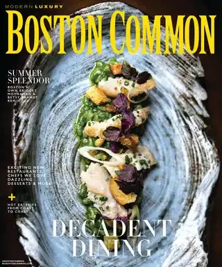 Cover of Boston Common magazine with a modern luxury restaurant dish featuring seafood and garnishes on a swirl plate, with the headline "Decadent Dining."