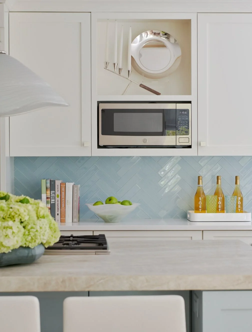 Sharing our kitchen of the day with Robin&rsquo;s egg blue island and creamy white perimeter cabinetry.  The glass tile backsplash was perfectly installed by Angel@ojedangelcontracting. Thank you so much for your expertise!  #customkitchendesign #mod