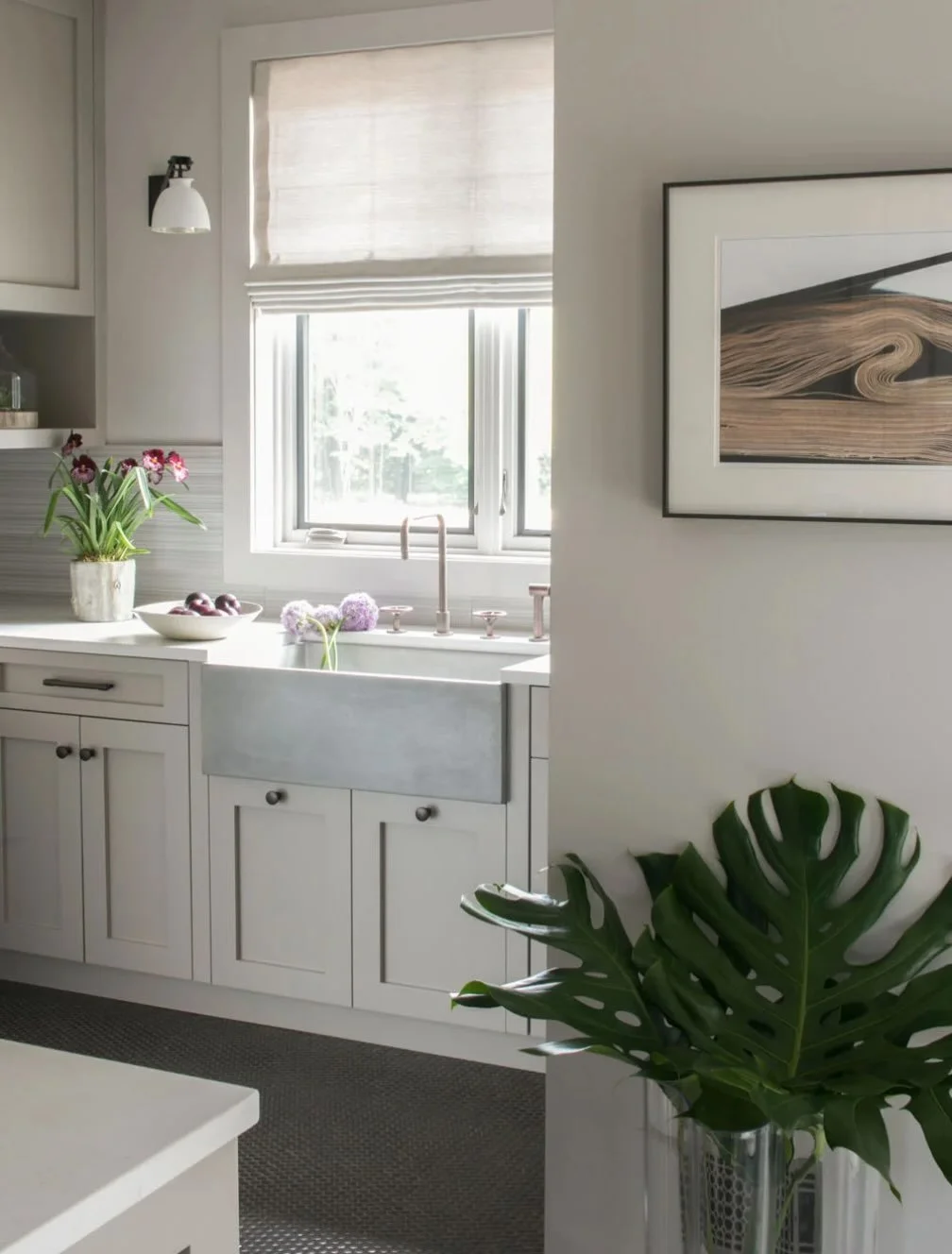 Color of the day is timeless taupe in our back kitchen pantry.  So functional with wall to wall cabinetry! Concrete sink which is perfect for flower cutting from the garden.  Copper metal penny flooring is perfectly rustic.  Photo by Neil Landino.  #