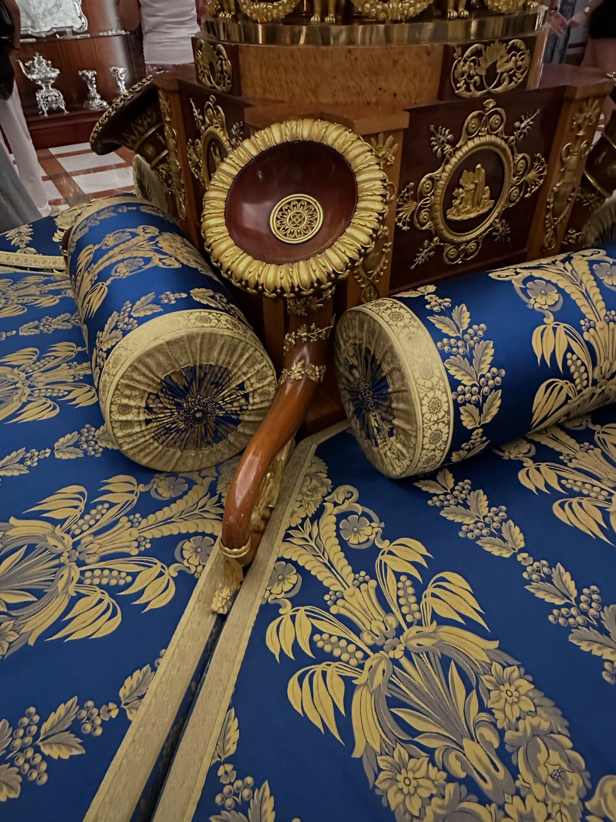 The ottoman of the day is called the gossip chair.  Women in the Royal Palace in Madrid could whisper secrets into the wooden speakers.  Hilarious!
#palaceseating #interiordesign #royalfabrics #designerdeb