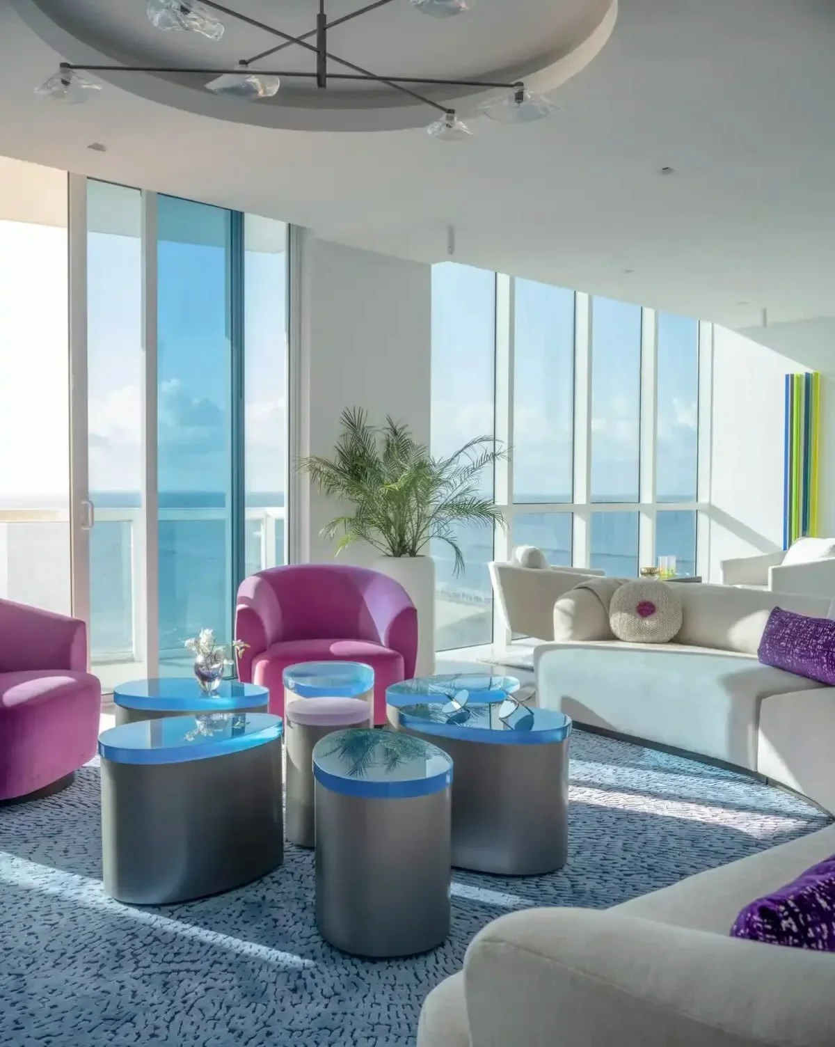 This Great Room floor plan was inspired by the ocean waves showcasing the @carinilangcarpets custom rug with amazing texture and color.  The custom petal movable tables are placed under the circular ceiling.  Photo by Neil Landino.  #customproject #m