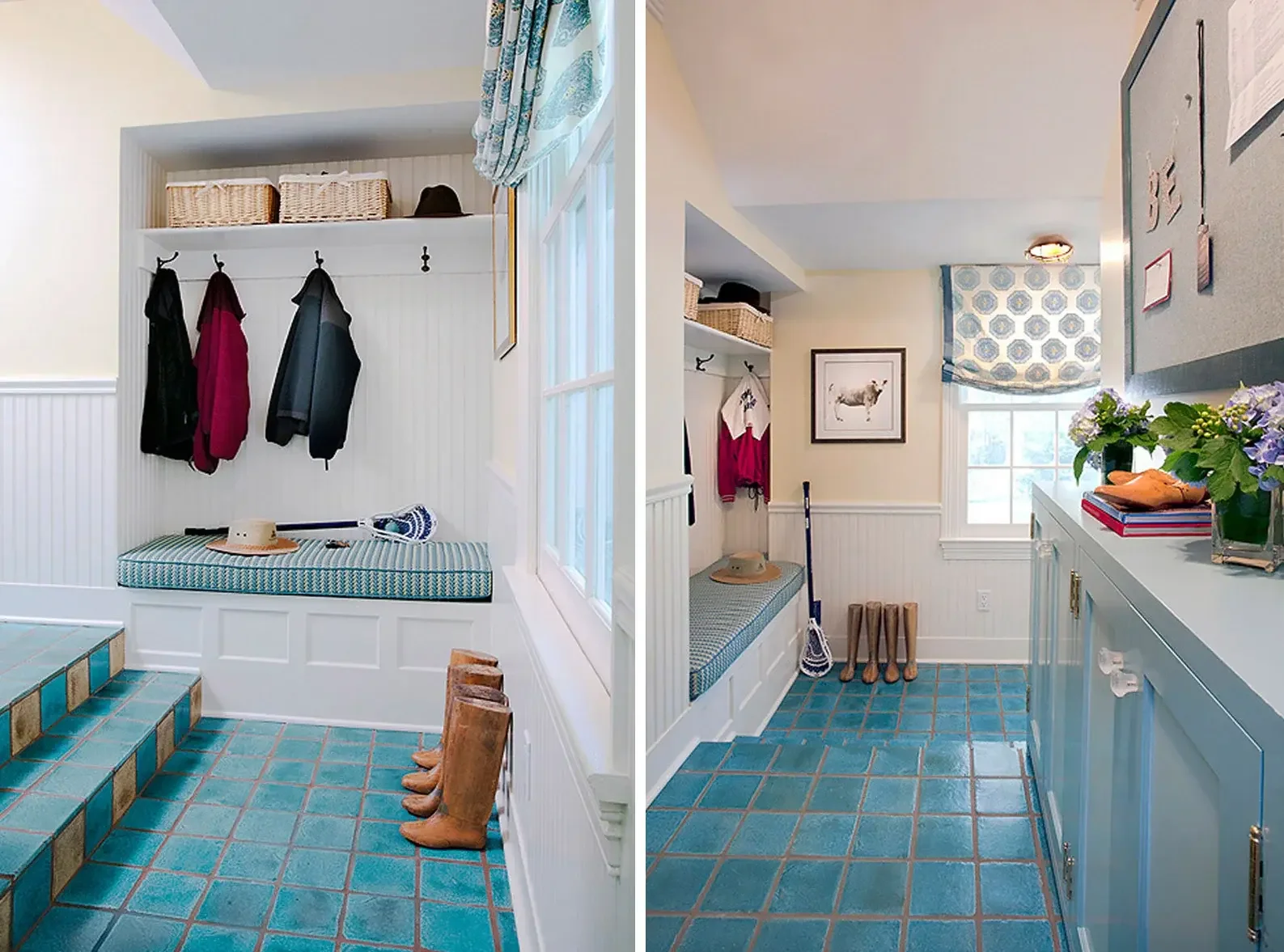 A cozy mudroom with built-in seating, coat hooks, and a window with a blue-patterned curtain. The seating has a cushion, and there are boots and a hat on it. Opposite, there is a blue cabinet topped with books and flowers, and a bulletin board on the