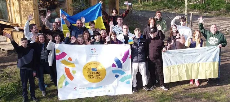 Group of people holding Ukrainian flags