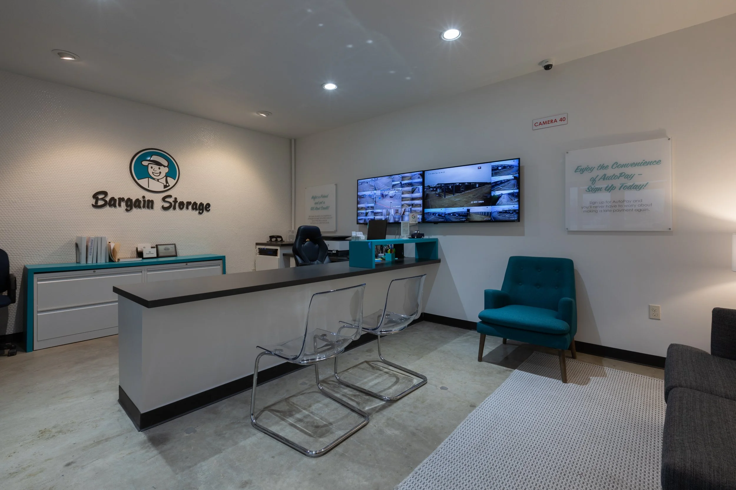 Bargain Storage office interior with a live security camera monitor wall at the Wylie, TX location