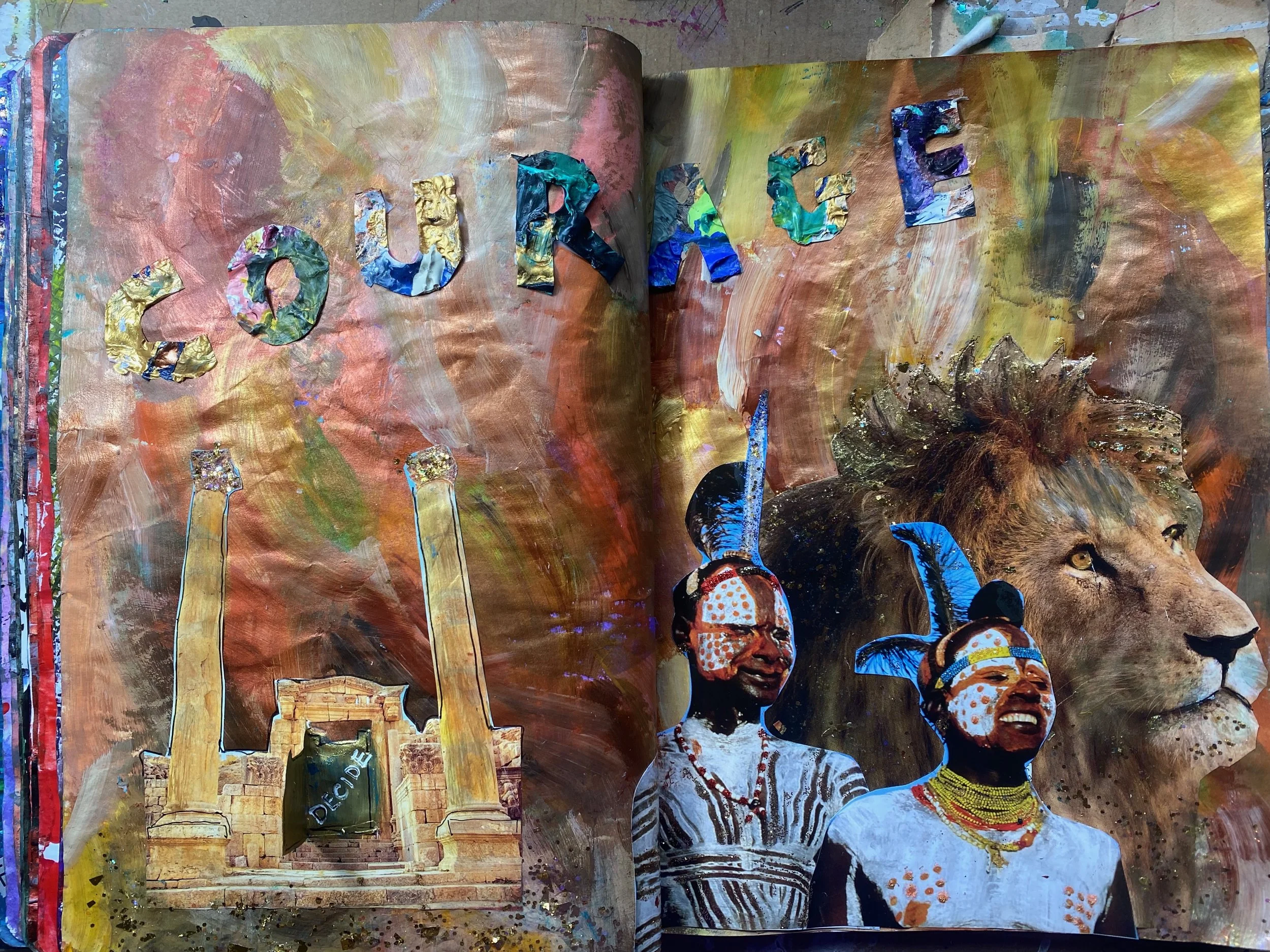 An art journal with painted background and collage, displaying the word 'our' spelled out with textured, metallic letters, with colorful portraits of people wearing traditional African clothing and jewelry at the bottom.