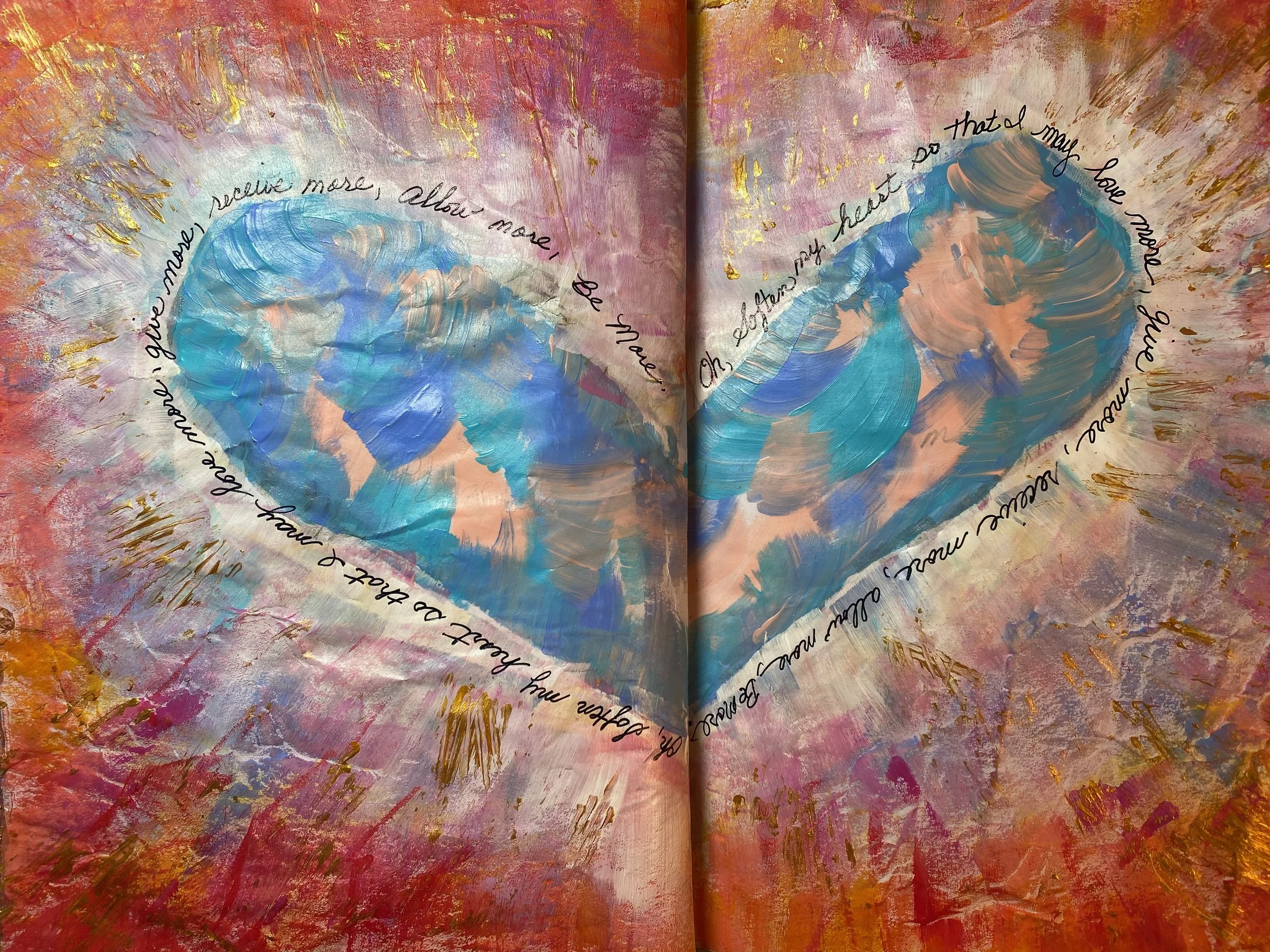 An open journal with painted hues of pink, purple, blue, and gold. The pages feature circular brushstrokes and handwritten words in a circular pattern, reading: 'and love more, always more,' and 'you are enough just as you are.'