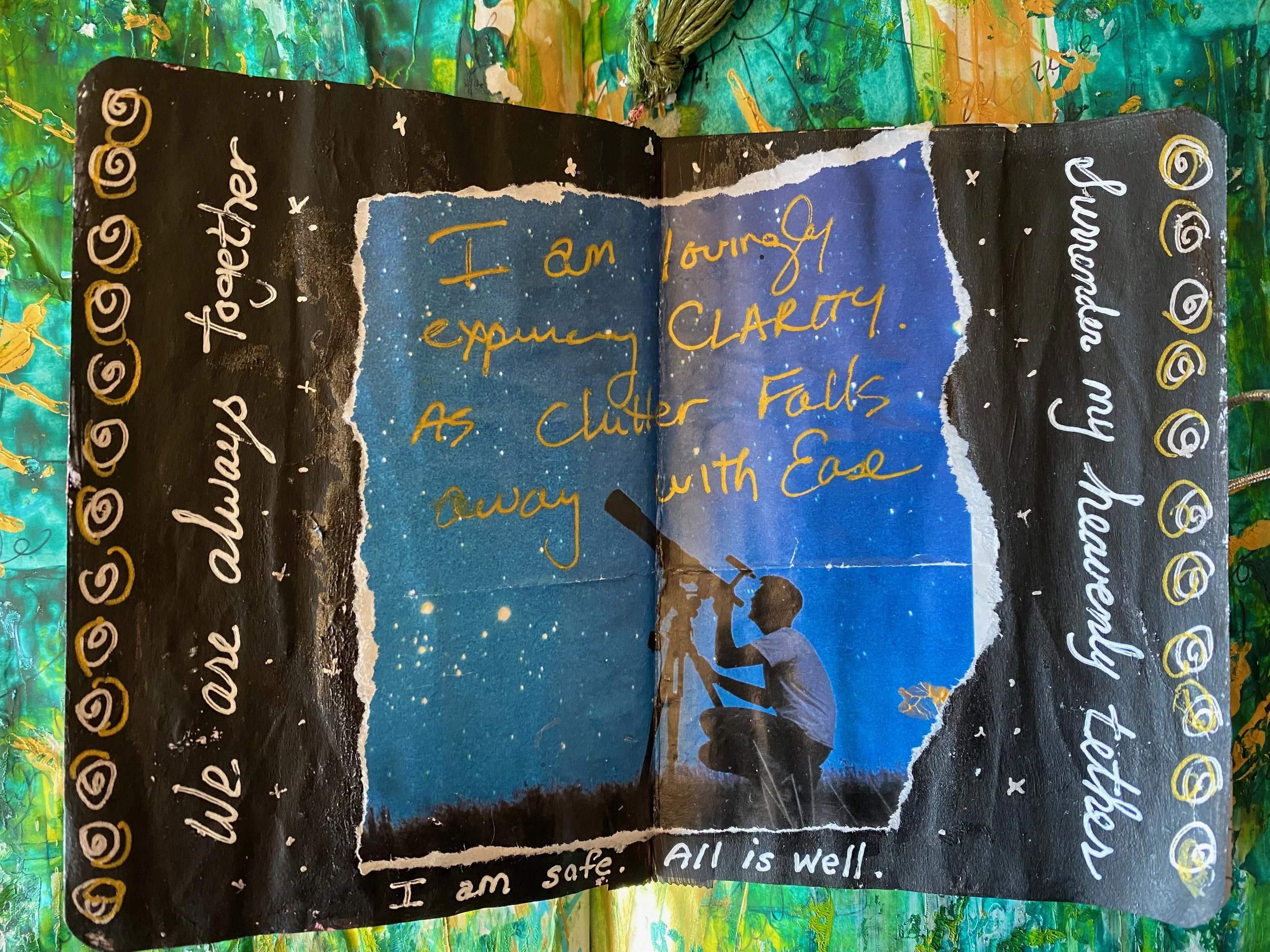 Colorful painting with a torn piece of paper revealing handwritten message that says, 'I am sharing my experience as a clutter falls away with ease.' Decorative borders with gold accents and a vibrant abstract background.