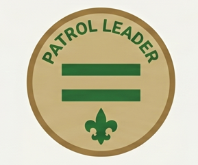 A circular badge with a tan background and green border, featuring the words 'Patrol Leader', two horizontal green lines, and a fleur-de-lis symbol at the bottom.