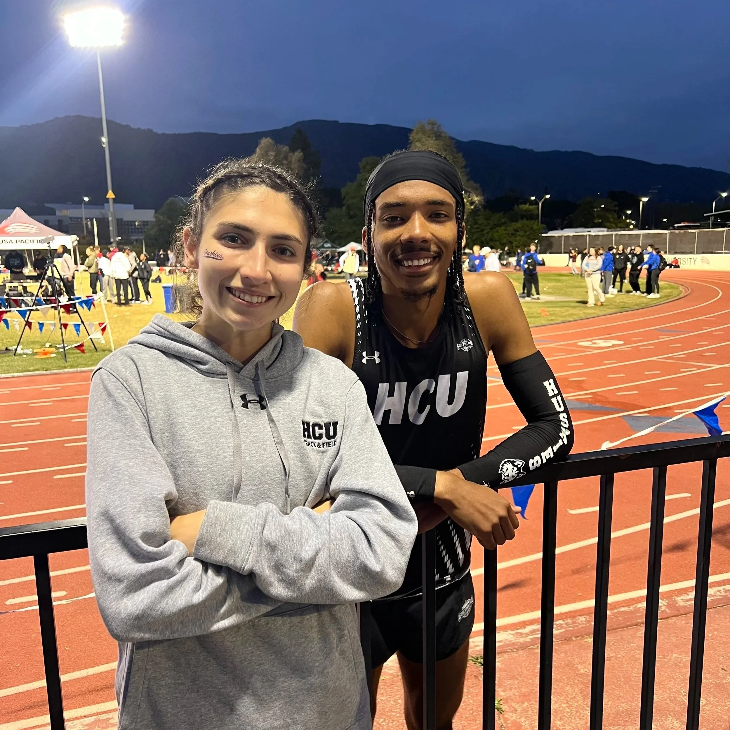 Jessica and Justice taking a celebratory photo after Justice races the fastest 5K in Houston Christian University school history of 14:16. Justice raced this at Bryan Clay Invitational. This is one of the fastest marks in Southland Conference History