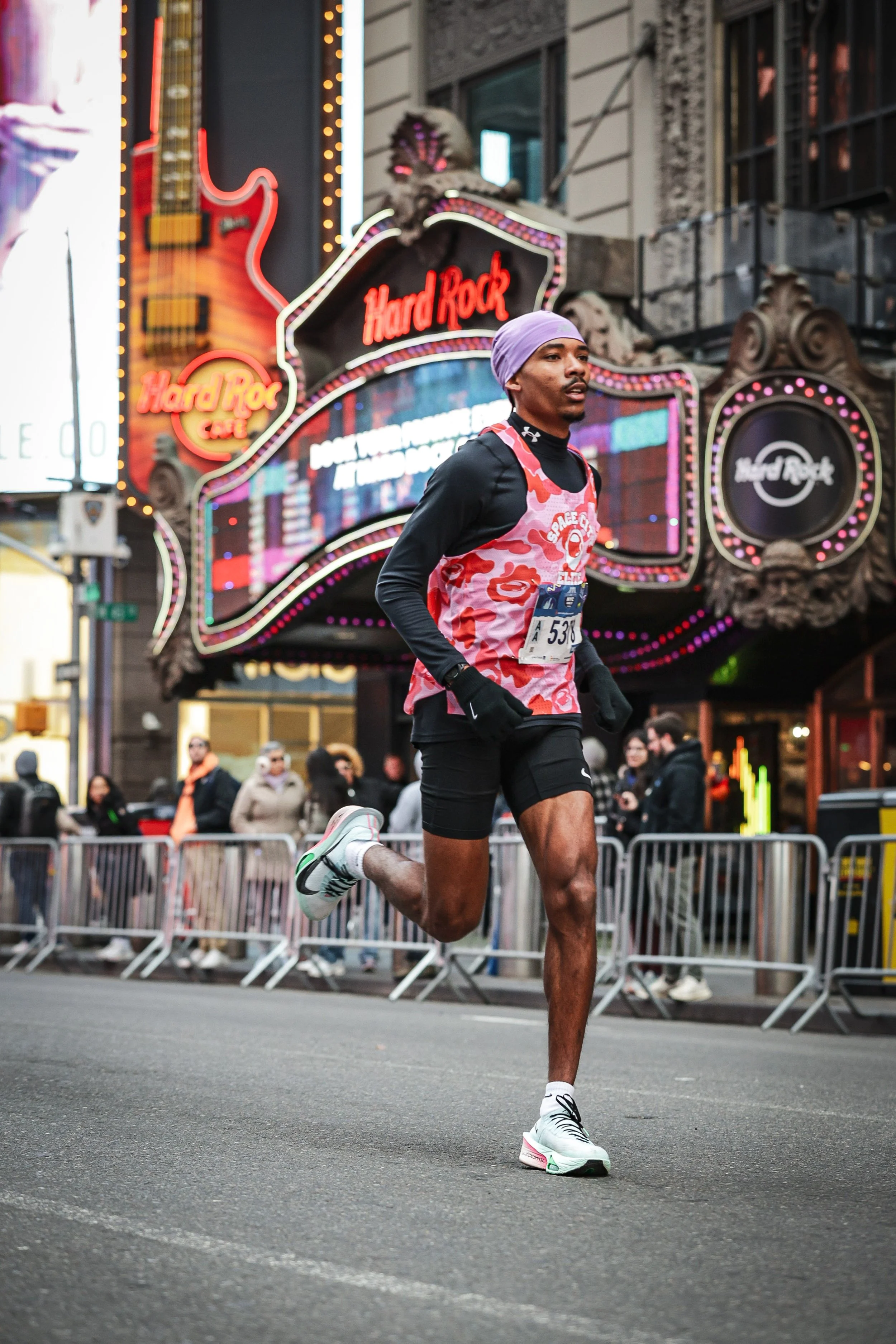 Justice Artisst racing the half marathon through New York City, cross the Hard Rock Cafe is located right in the middle of Times Square. Justice goes on to run his second fastest 13.1 ever in the Big Apple.