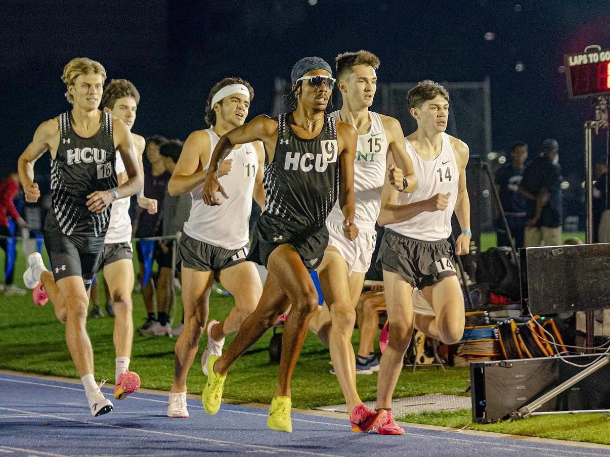 Justice Artisst sprinting across the finish line starting his last lap of the 1500m at Rice University. Justice goes on to be the fastest Houston Christian University athlete at the meet and runs a personal best - as a distance guy running the 1500m!