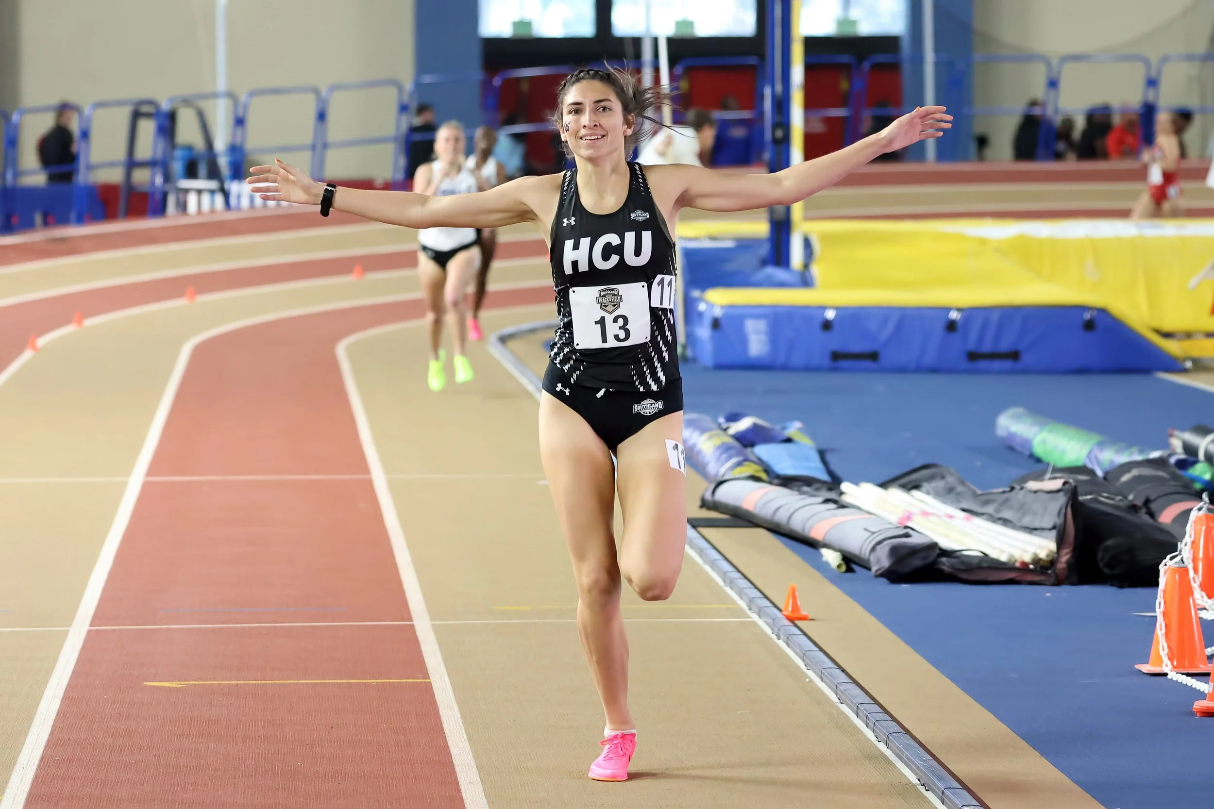 Jessica Rabius crossing the finish line at the Southland Conference Track meet where she ran away from the competition. Jessica went on to be the conference champion in 2 distance events that meet, the 1 mile and the 3000 meters.