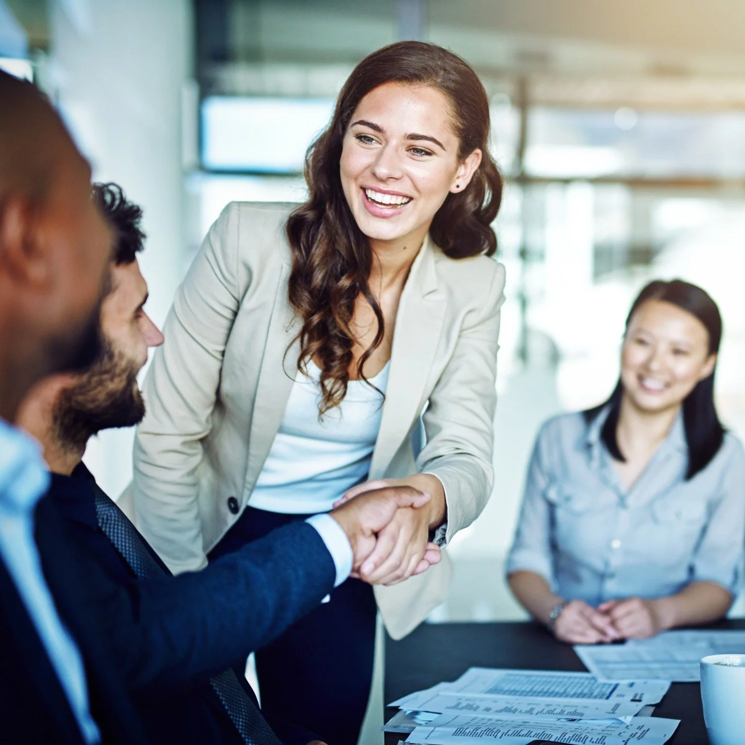 Business Meeting, woman shaking hands with a man, ERP staffing process