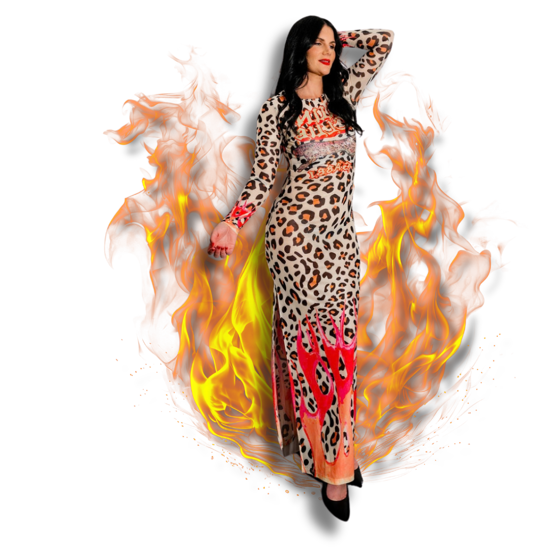Woman in a leopard print dress with red accents, standing with one arm raised behind her head, surrounded by flames.