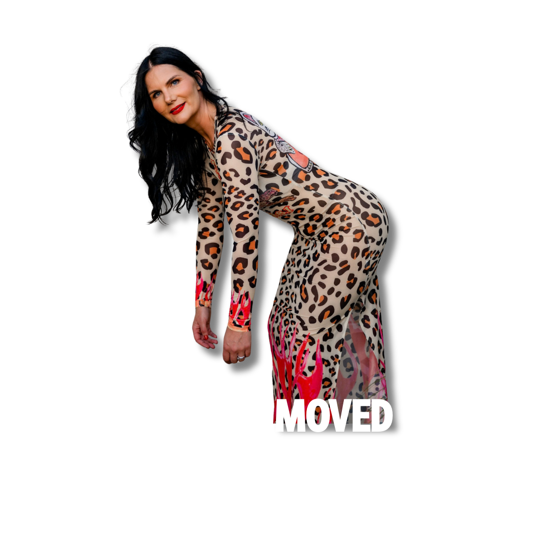 Woman in leopard print dress with red accents, bending forward with black hair and red lipstick, on a black background with partially hidden text.