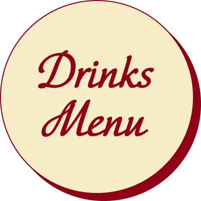 A circular sign with a cream background and red border, displaying the words 'Drinks Menu' in cursive red font.