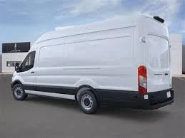 White cargo van parked in an outdoor lot