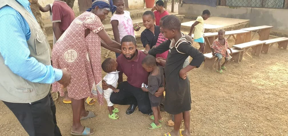 receiving the blessing from orphan children