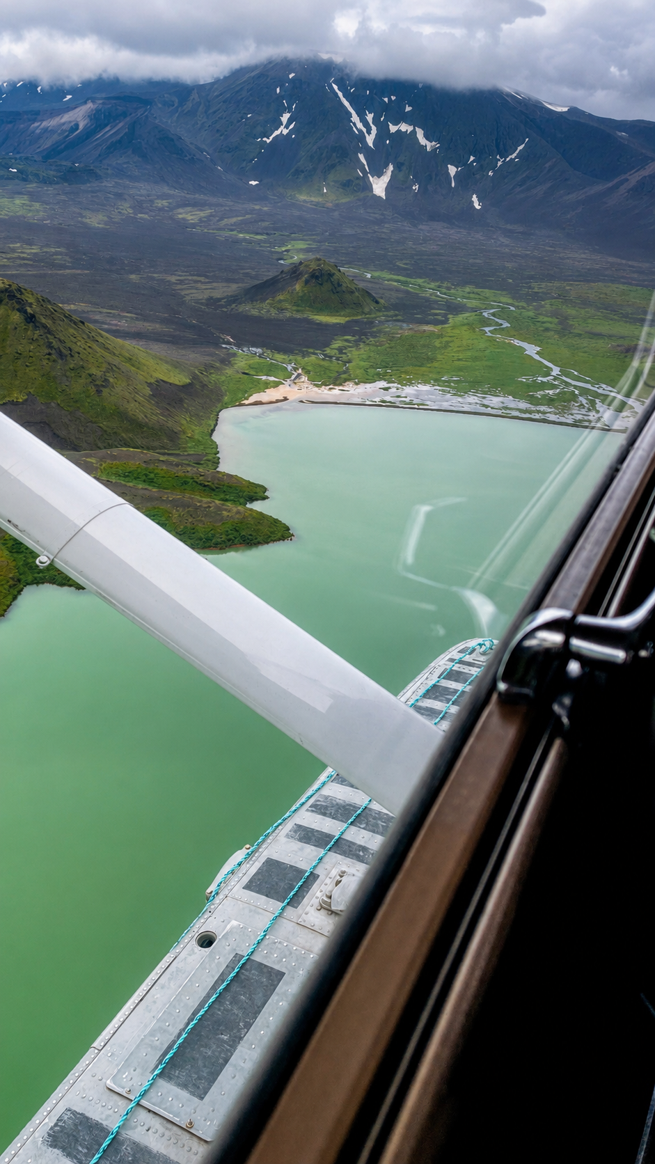 Aerial view of Alaska Peninsula mountains and lakes from a floatplane.