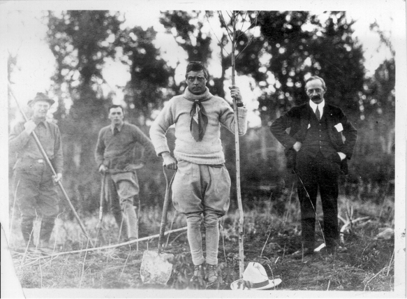 William Reader (far right) instructing the Prince of Wales (centre) while planting trees at the E.P. Ranch in the 1920s. Courtesy City of Calgary.