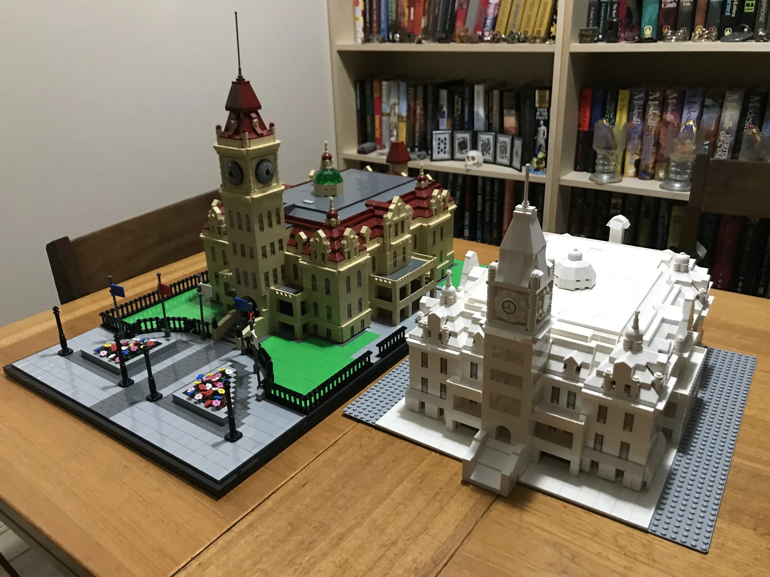 “Version 4” and “Version 2” of Lego City Hall. Version 4 was displayed in the lobby of the Municipal Building while the restoration project was underway.