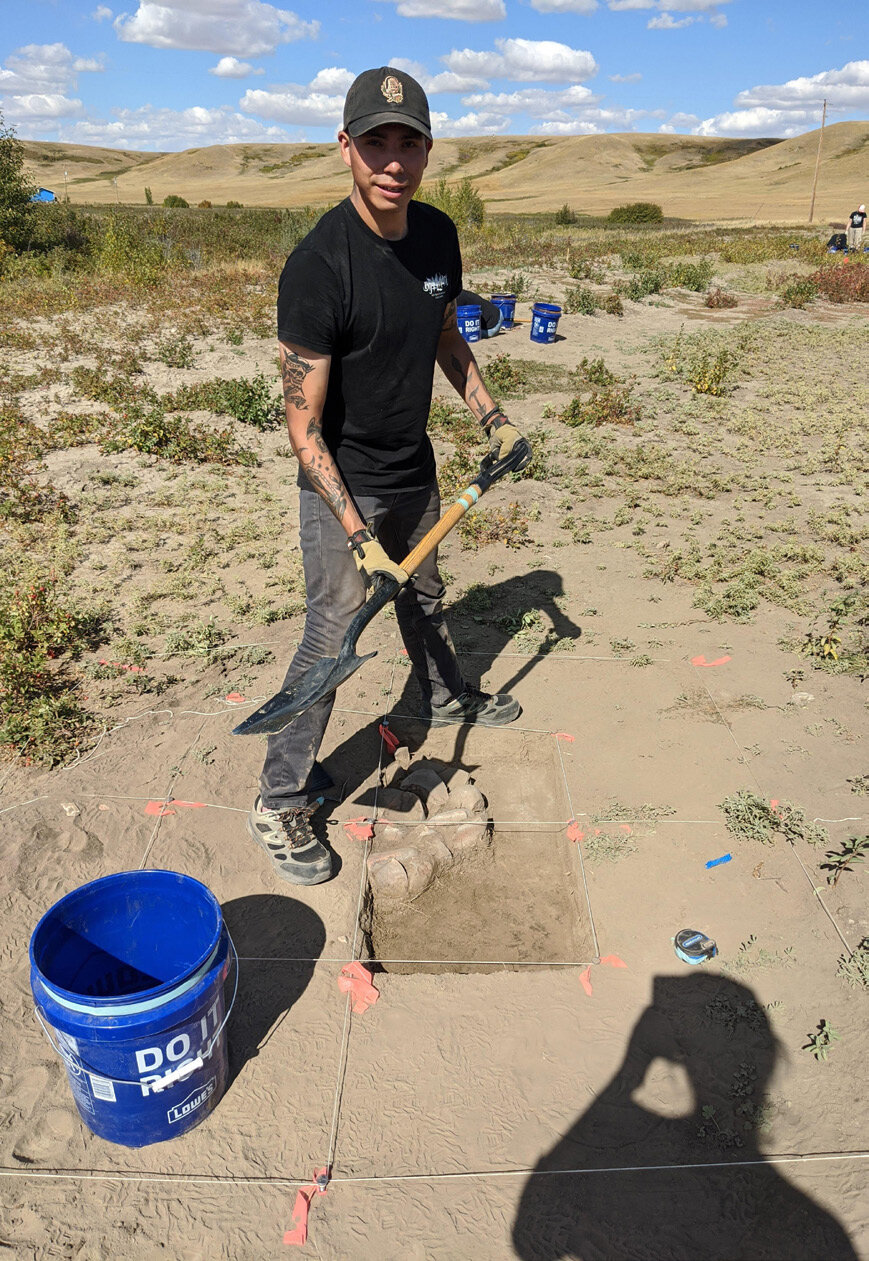 Brendon Many Bears Excavating a Roasting Pit Feature. Courtesy of University of Calgary / Old Sun Community College.