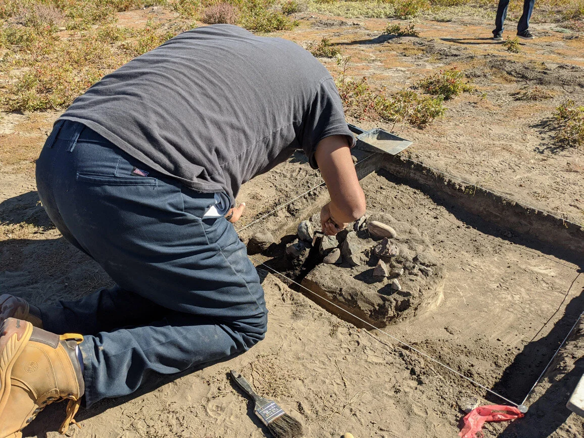 Theo Maguire Excavating a Hearth Feature at EePf-54. Courtesy of University of Calgary / Old Sun Community College.