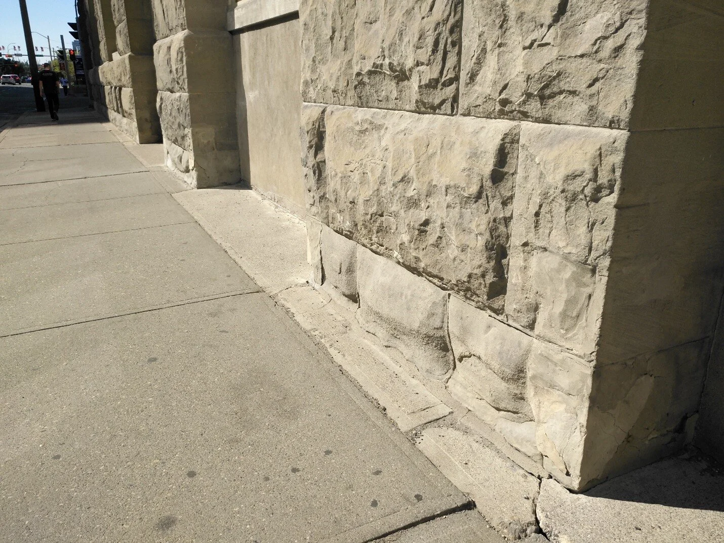 Note the heavy erosion on the sandstone at sidewalk level on the Customs House at 134 11th Avenue SE. Photo: C.W. Gross.