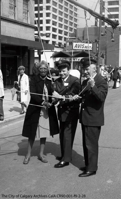 “Last trolley bus run, #422 on May 8, 1975, with Alderman Virnetta Anderson and trolley operator Ted Kendrick. Photo from the City of Calgary Archives.