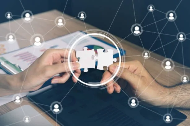 Two hands holding puzzle pieces that are about to connect, with digital network icons overlayed.