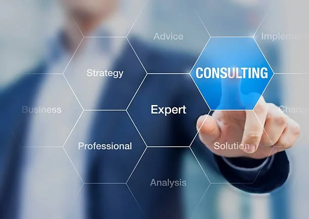 Person in business suit pointing at a virtual hexagonal diagram with words like CONSULTING, Expert, Strategy, and Solution.