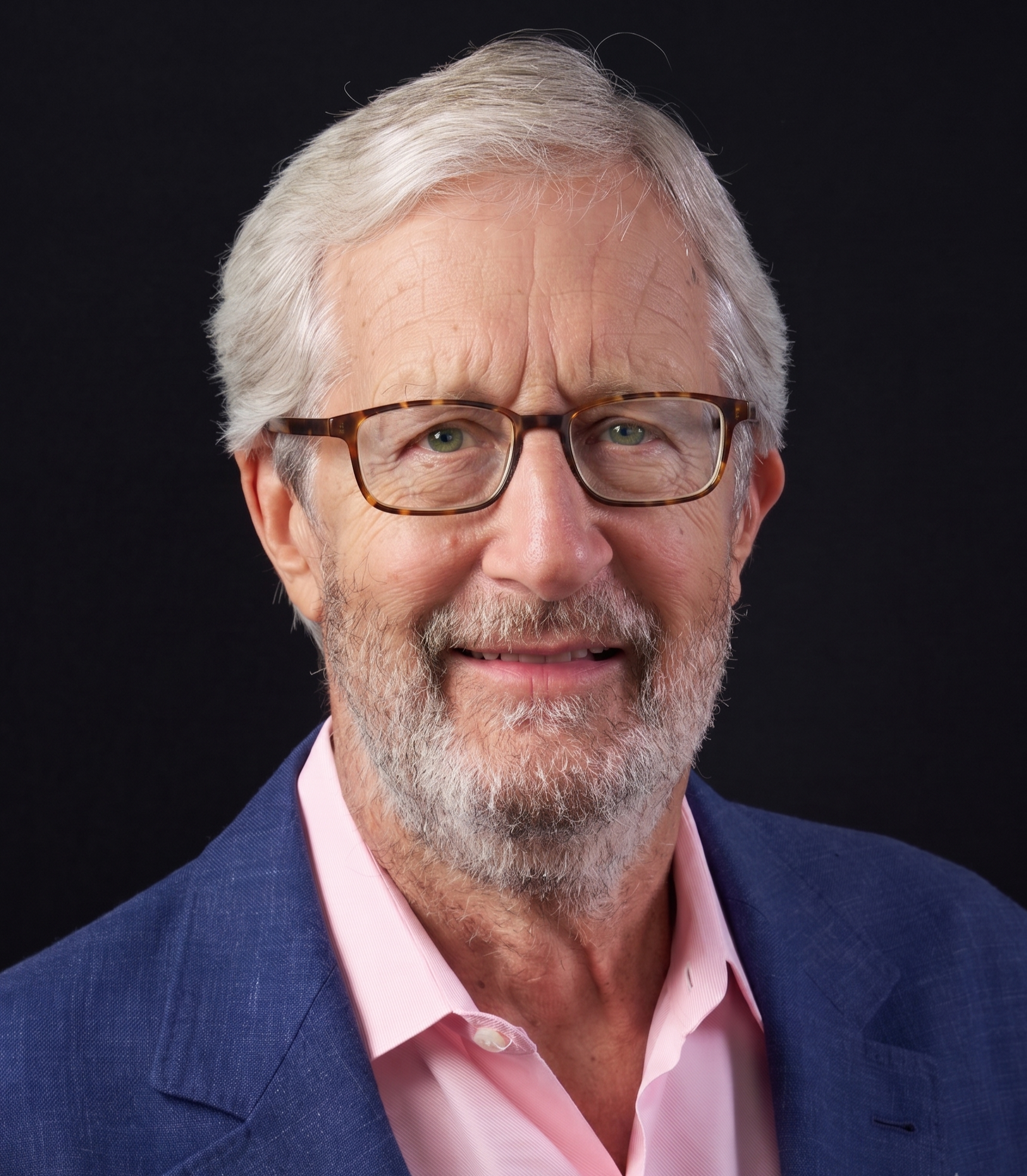 Headshot of author Chuck Thoele with gray hair, wearing tortoiseshell glasses, a pink collared shirt, and a blue blazer against a black background.