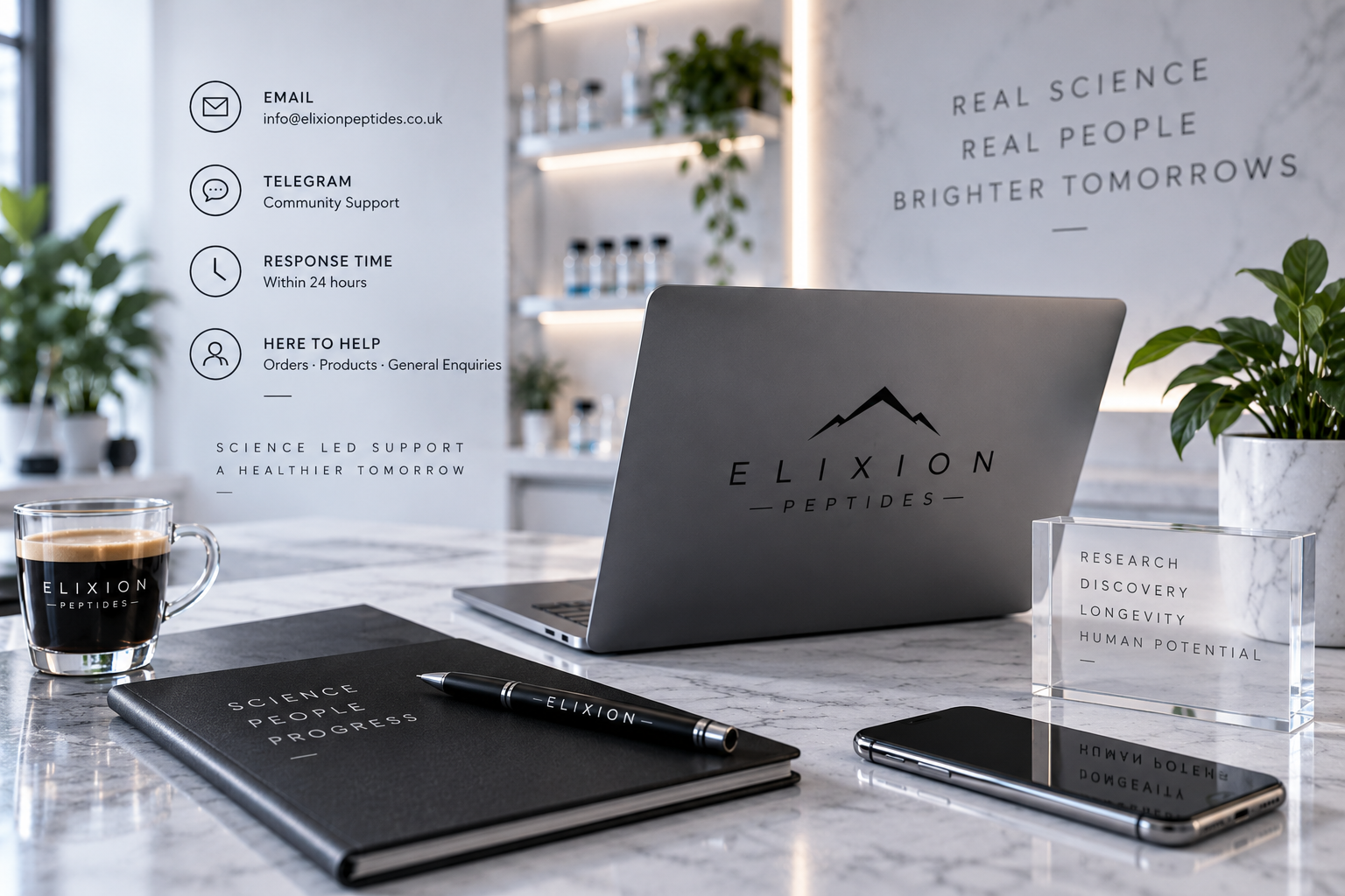 A modern workspace with a laptop, black notebook, pen, smartphone, coffee cup, and potted plants, featuring informational signage and branding for Elixion Peptides on the marble table.