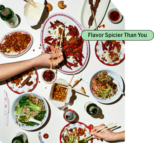 Empty and partially eaten dishes of spicy peppers, salad, rice, and fried foods on a table with chopsticks, chopstick holders, soy sauce, and drinks, with a green text overlay saying "Flavor Spicier Than You."