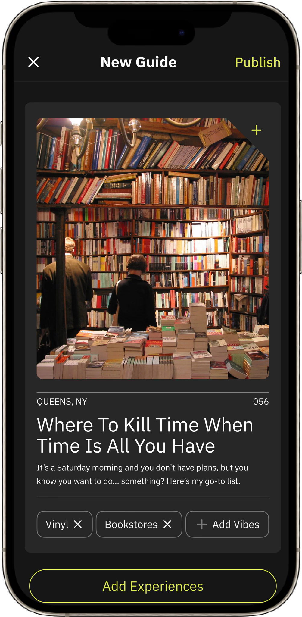 A photo of a bookstore with tall shelves filled with books, and a table with stacks of books in front. Two people are browsing in the store. The display is for a book titled 'Where To Kill Time When Time Is All You Have' by an author from Queens, NY.