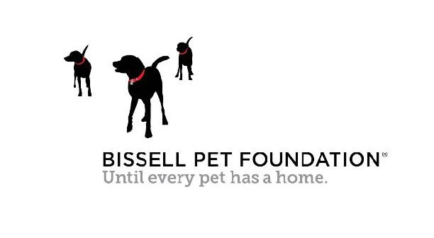 Illustration of three black dogs wearing red bandanas above the text 'Bissell Pet Foundation' with the tagline 'Until every pet has a home'.