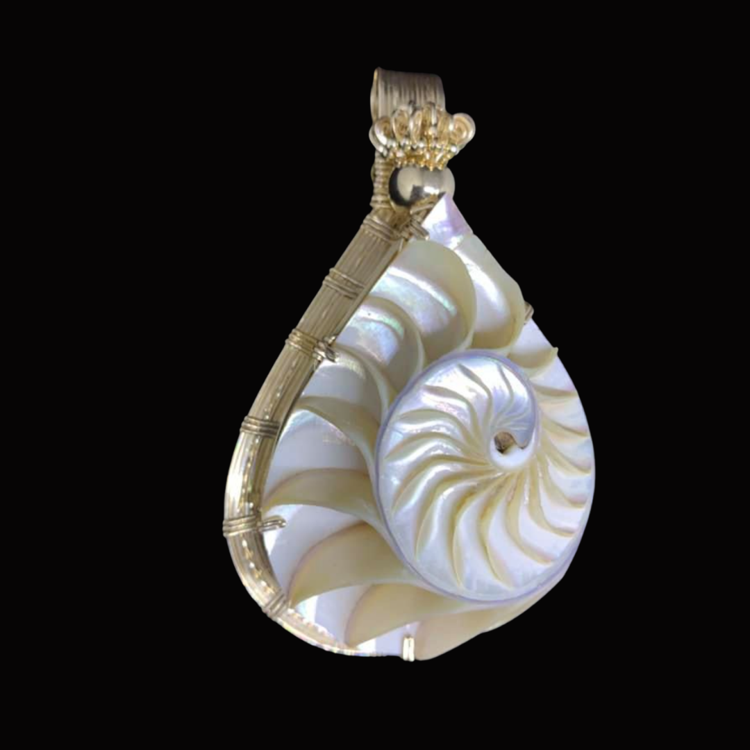 Elegant pendant featuring a carved white shell in a spiral shape with gold accents and a loop at the top for attaching to a chain, set against a black background.